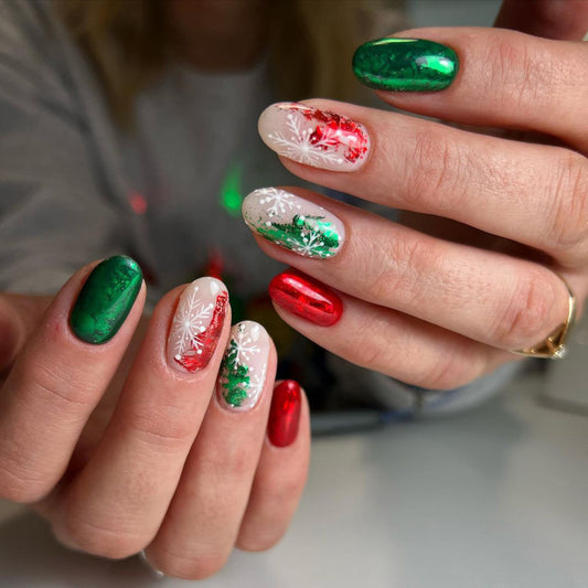 A set of press-on nails featuring a snowflake pattern with red, green, and white colors.