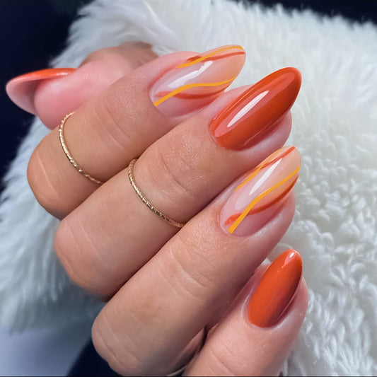 Sunset Glow Long Oval Coral Press On Nail Set with Abstract Swirl Accents