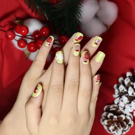 Festive Holiday Short-Length Squoval Press On Nails Set in Cheerful Yellow with Candy Cane and Snowflake Accents
