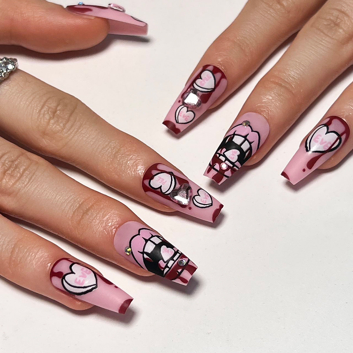 Romantic Rendezvous: Medium Coffin Baby Pink Press On Nails with Heart and Grid Accents