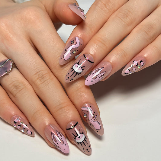 Enchanted Whimsy Long Almond Blush Pink Nails with Black Artistic Accents and Crystals