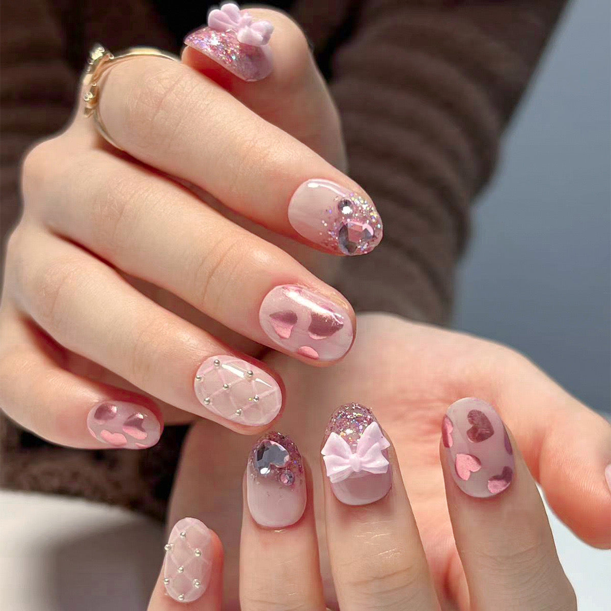 Sweetheart Medium Oval Pink Press-On Nails with Glitter Accents and 3D Bow Design