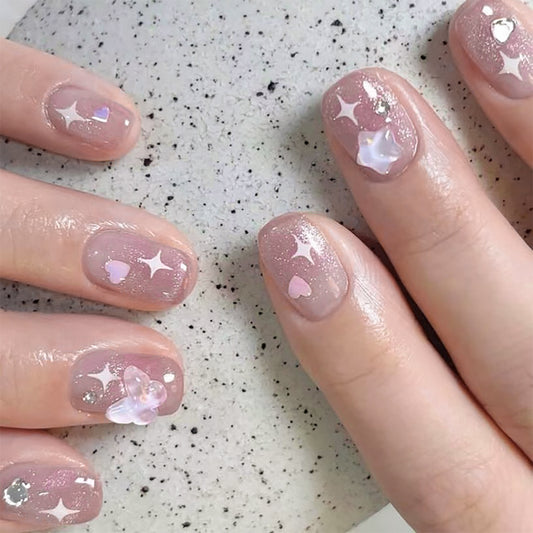 Petite Blossom Short Squoval Press-On Nails in Sheer Pink with Crystal Embellishments and Star Accents