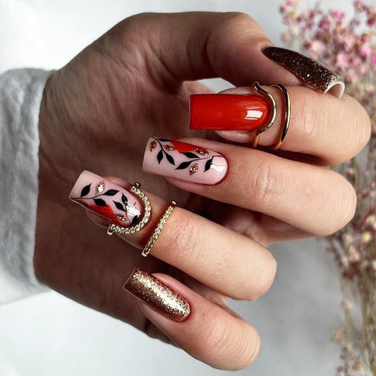 Spiced Latte Long Square Peach Press-On Nail Set with Burnt Orange and Glitter Accents and Black Leaf Patterns