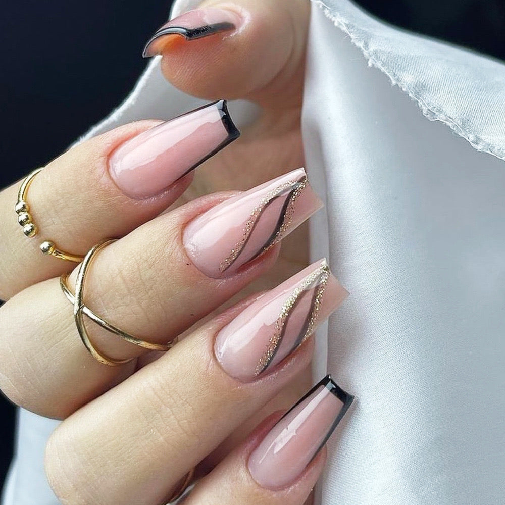 Elegant Long Coffin Blush Pink Press-On Nails with Glittering Gold Accents and Bold Black Tips