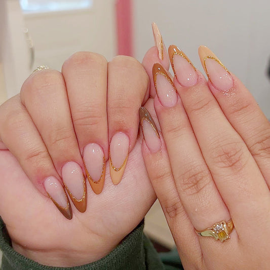 Golden Aura Long Almond Translucent Nails with Metallic Accents