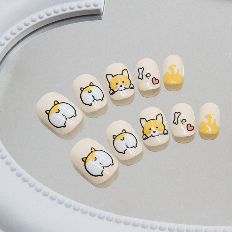 Playful Paws Short Squoval Cream Press-On Nail Set with Corgi Illustrations and Paw Print Accents