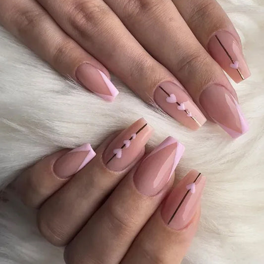 Elegant Romance Medium Coffin Blush Pink Press-On Nail Set with Heart Accents and Negative Space Design