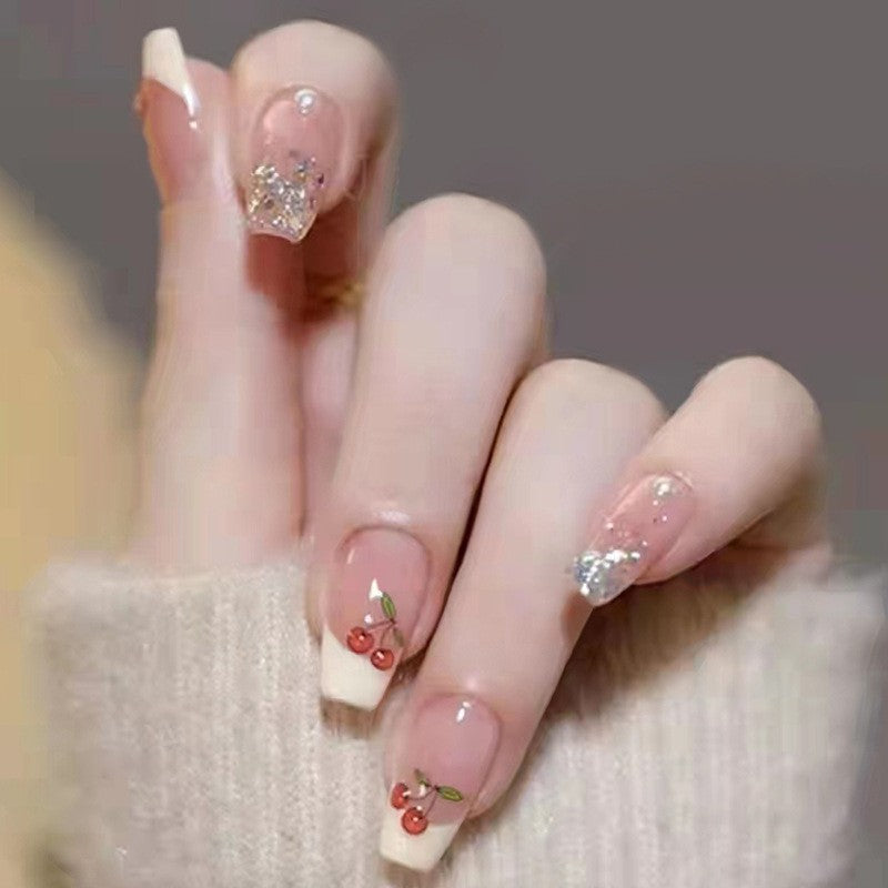Winter Whimsy Long Coffin Translucent Press-on Nails with Cherry Blossom Accents and Glitter Highlights
