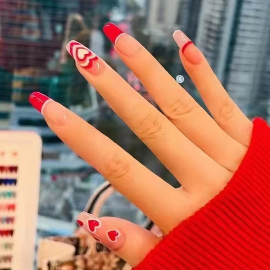 Passionate Embrace Long Coffin Press-On Nails in Classic Red with Accent Swirls and Heart Designs