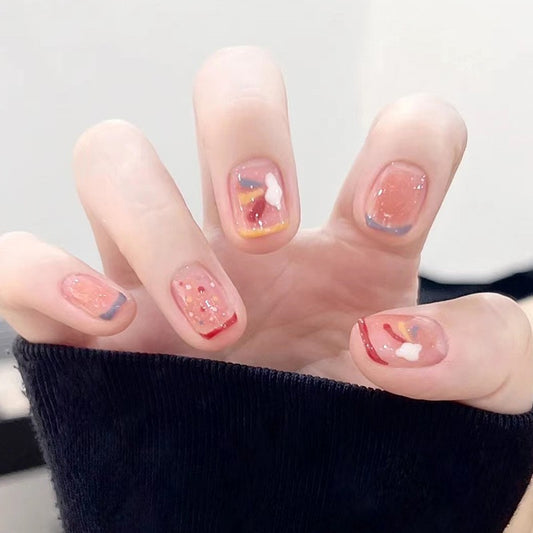 Playful Short Squoval Multi-Colored Press-On Nail Set with Glitter and Abstract Art Design