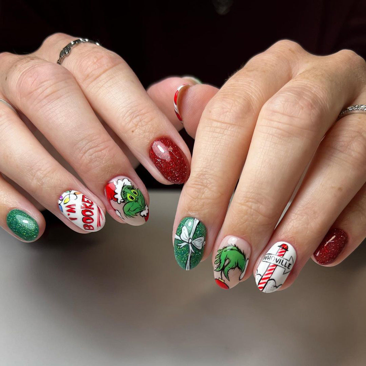 Nails with festive designs on a neutral background