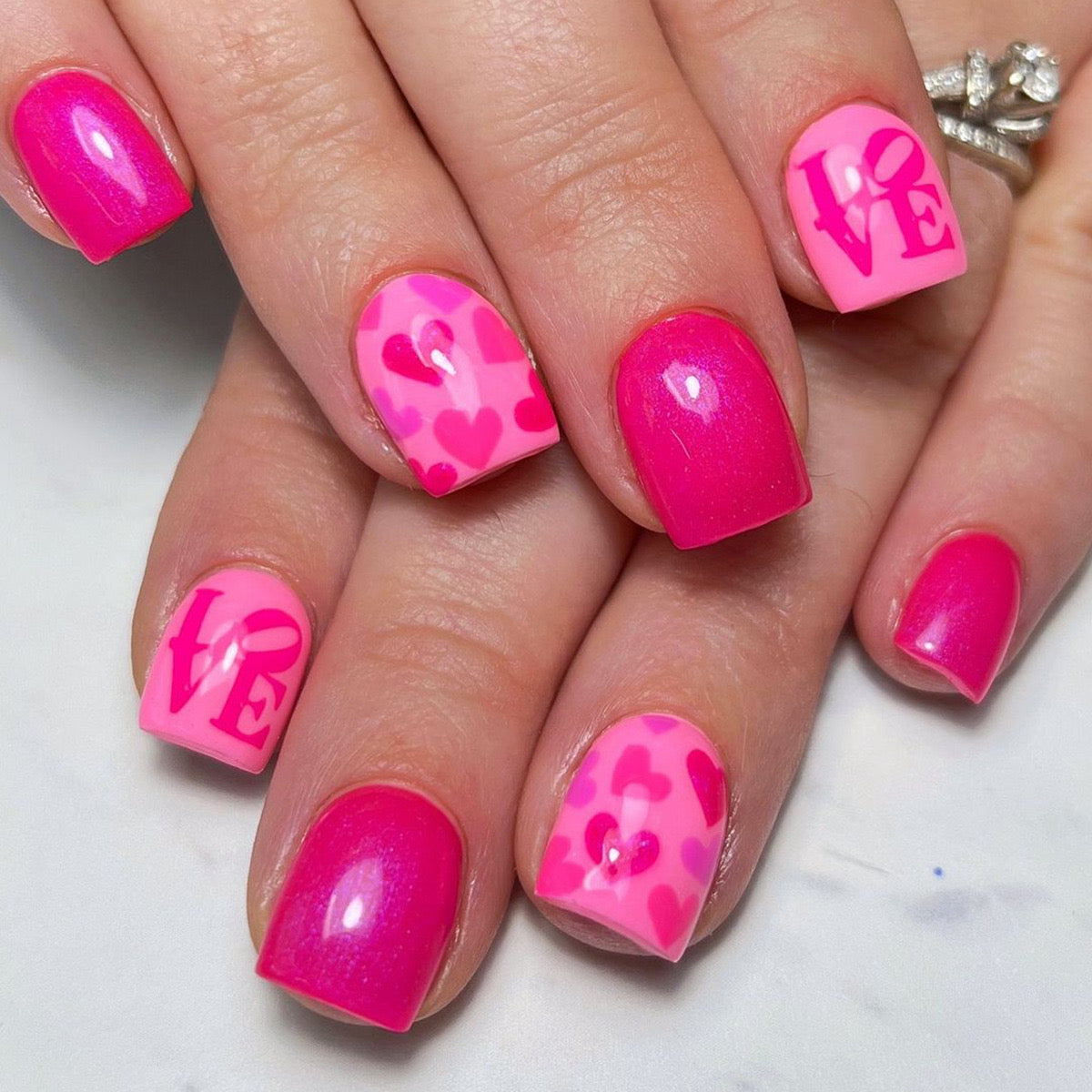 Passionate Affair Short Square Vibrant Pink Press-On Nails with Heart Patterns and Love Script Detailing
