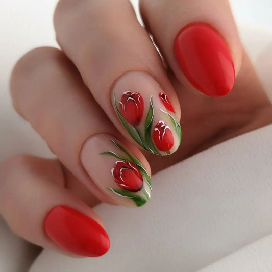 Nails with red nail polish and floral design on a white background