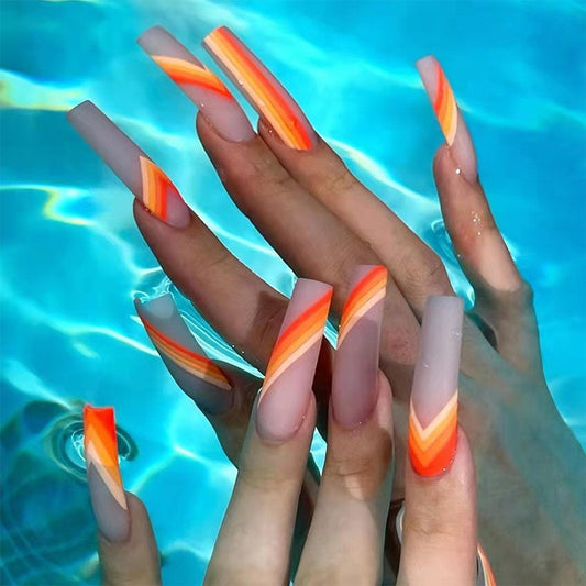Summer Heat Extra Long Coffin Beige Press On Nails with Vibrant Orange and Yellow Swirl Accents