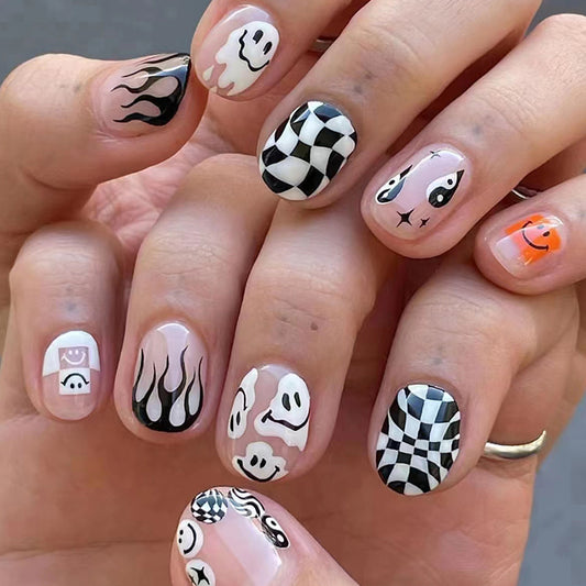 Spooky Elegance Short Round Beige Press On Nail Set with Black and White Accents Ghost and Flame Designs