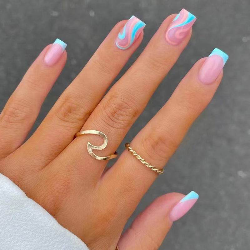 Cotton Candy Skies Short Square Pink Press On Nail Set with Blue French Tips and Swirl Design