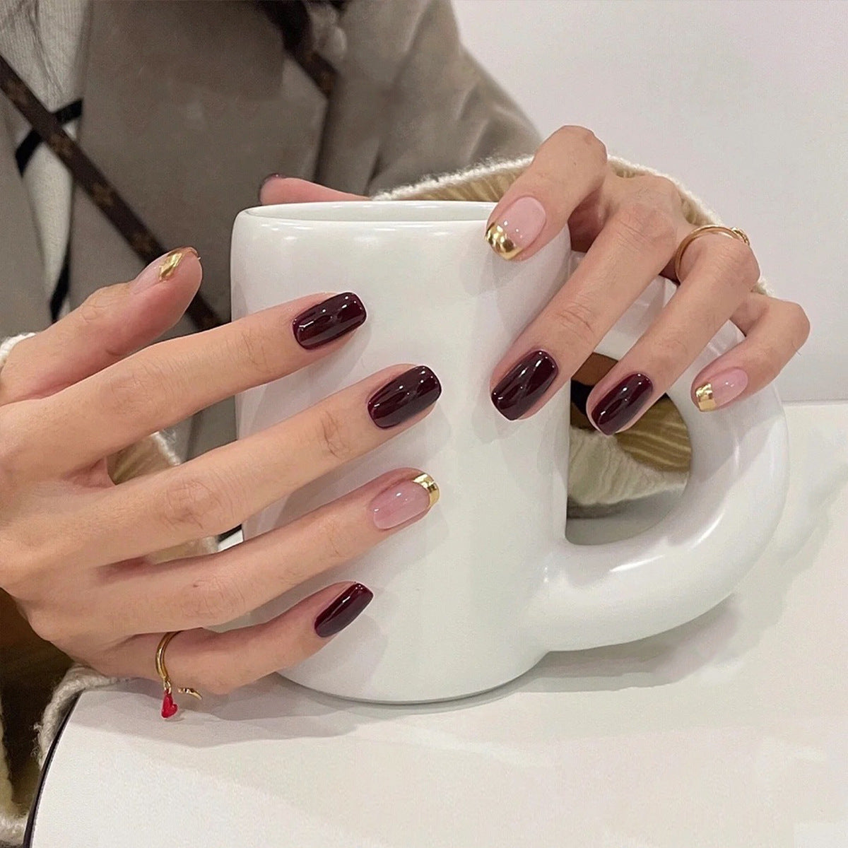 Caf‚âàŒ© Chic Medium Squoval Burgundy Press On Nail Set with Gold Tips and Pink Beige Base