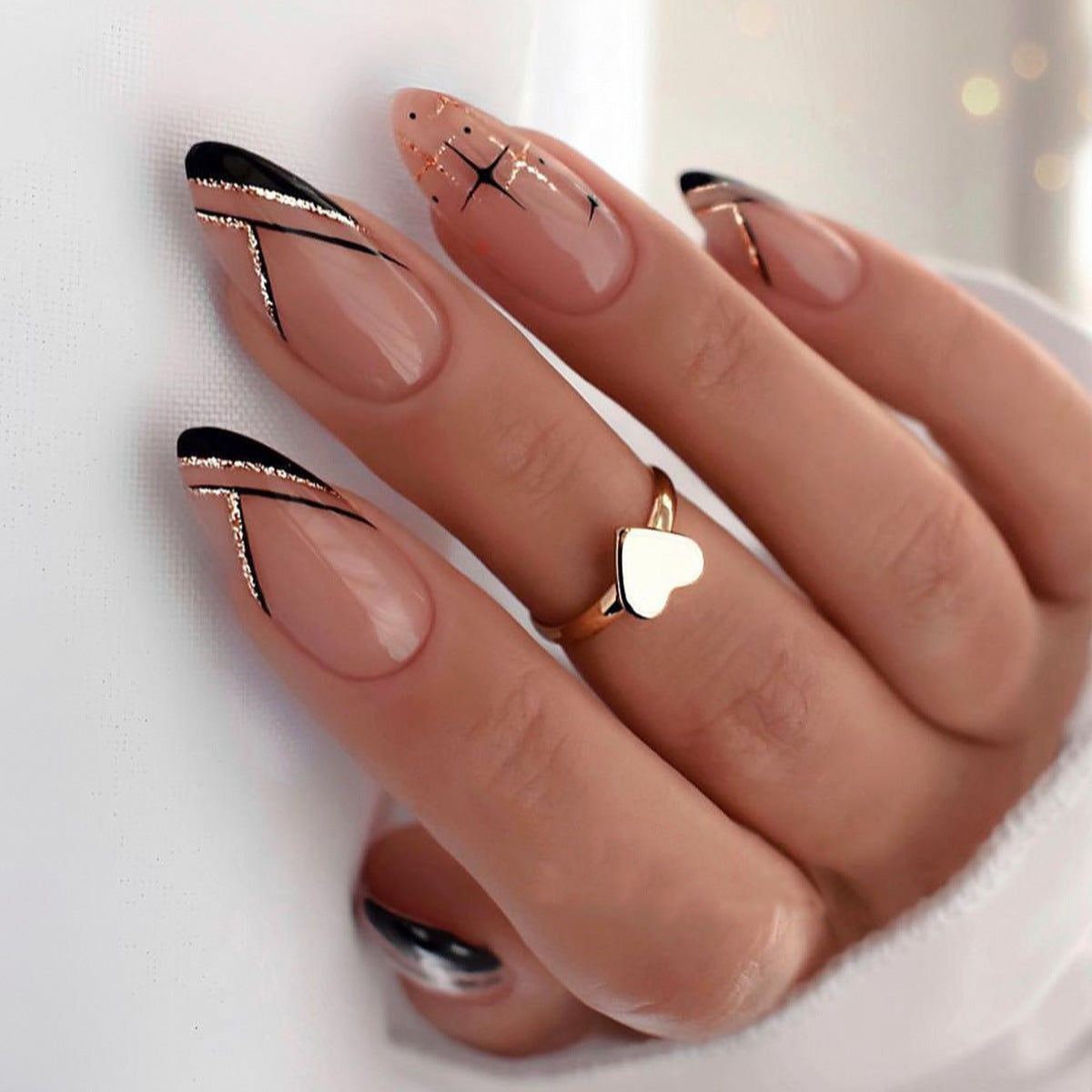 Sophisticated Noir Medium Almond Beige Press On Nails with Black Tips and Gold Detailing