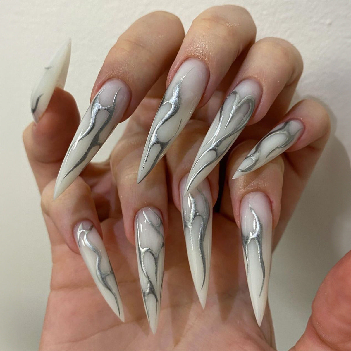 Futuristic Extra Long Stiletto Beige Press-On Nails with Metallic Silver Marbling