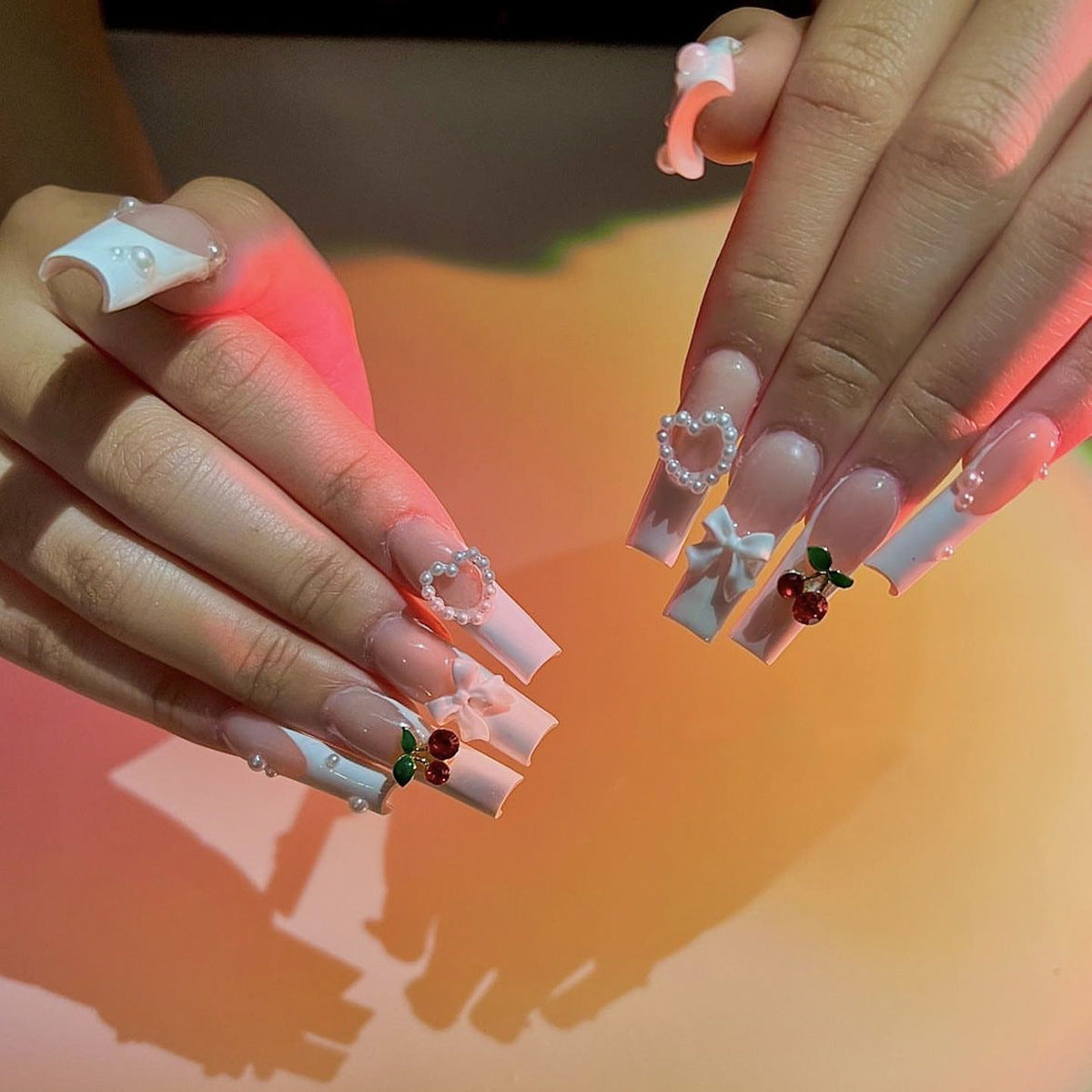 Enchanted Evening Long Coffin Pink and White Gradient Press-On Nails with Heart and Cherry Accents