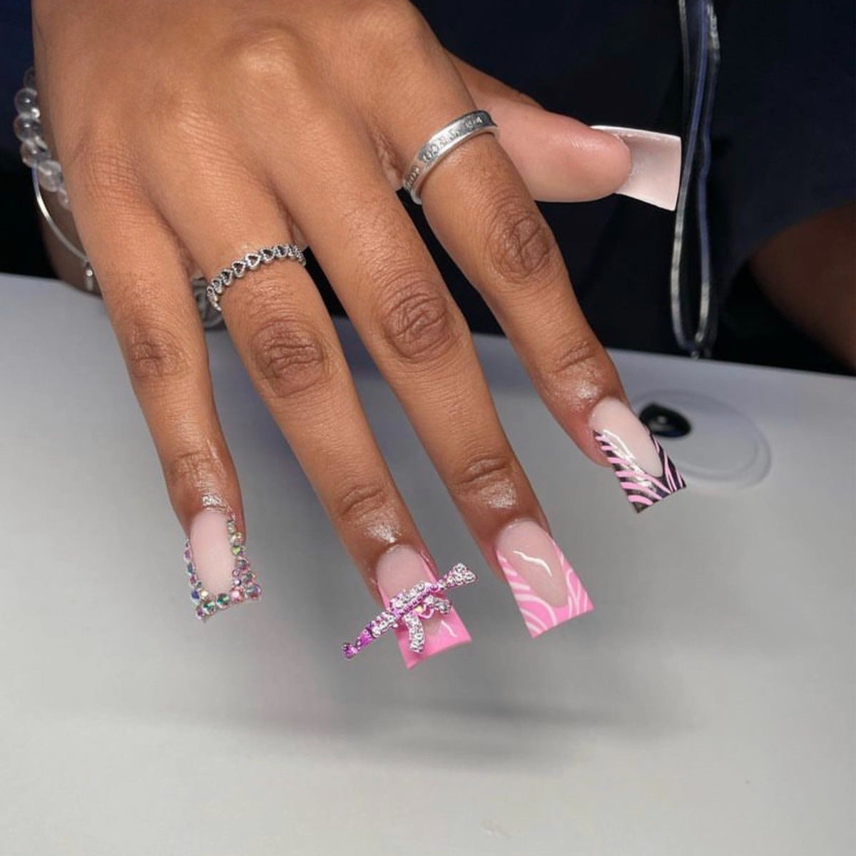 Bold Long Duck Pink and White Press-On Nails with Zebra Pattern and Crystal Bow Accents