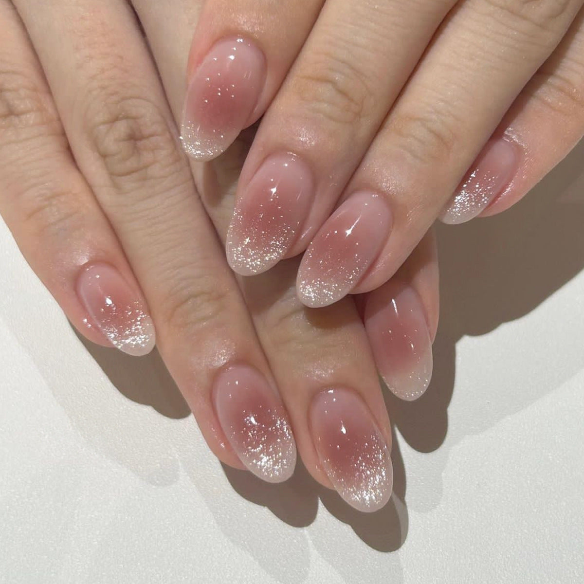 Elegant Long Oval Translucent Nails with Glitter Gradient Tips