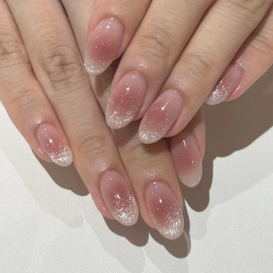 Elegant Long Oval Translucent Nails with Glitter Gradient Tips