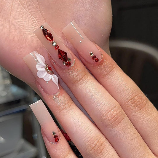 Elegant Soir≈Ωe Long Square Press-On Nails with Sheer Base, Red Gemstones, and Floral Embellishments