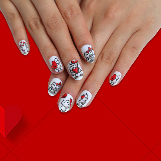 Holiday Joy Medium Oval White Press On Nails with Festive Red Cartoon Characters