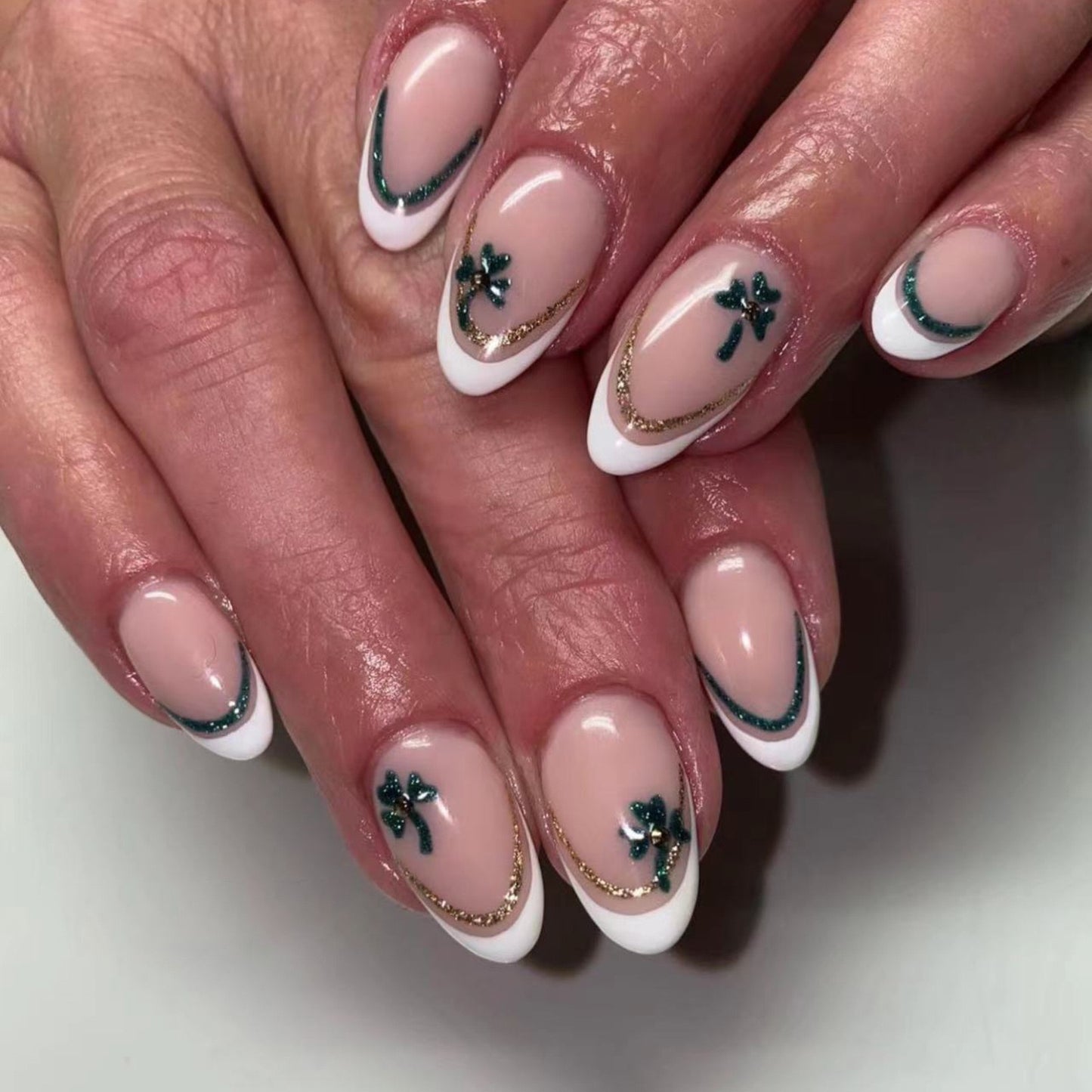 Elegant Charm Medium Round French Tip Pink Press-On Nails with Green Clover and Gold Chain Embellishments