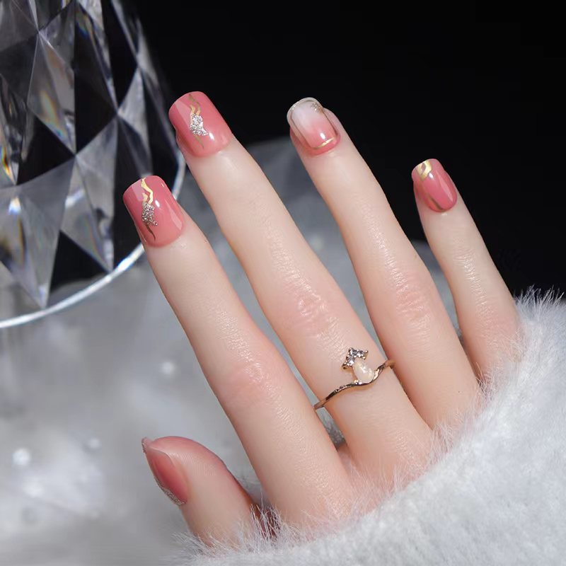 Elegant Affair Medium Squoval Peach Press On Nail Set with Gold Accents and Glitter Detail