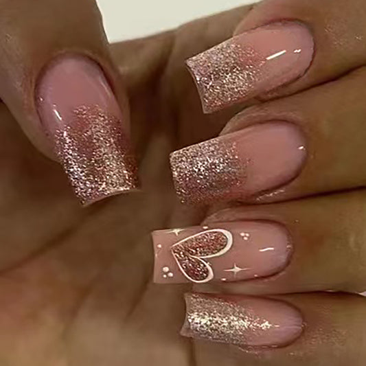 Chic Blush Romance Medium Coffin Press-On Nails with Rose Gold Glitter Fade and Heart Accent Design