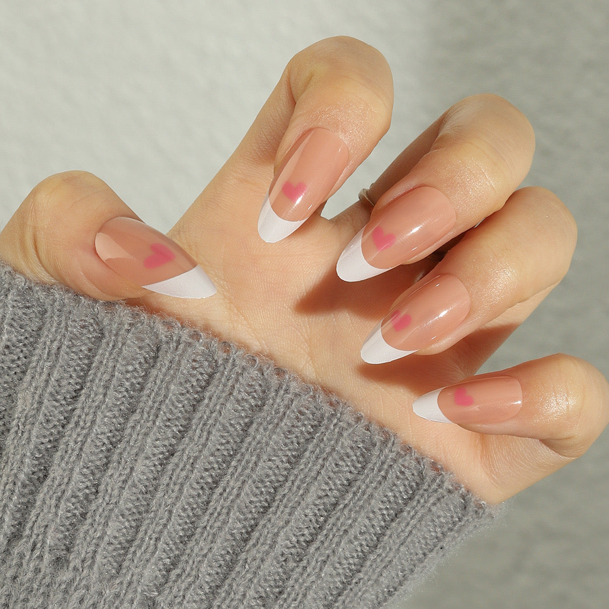 Romantic Bliss Medium Almond Soft Pink Press-On Nails with White French Tips and Heart Accents