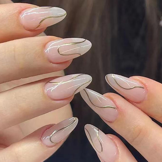 Elegant Medium Almond Translucent Press-On Nails with Glossy Finish and Metallic Accents