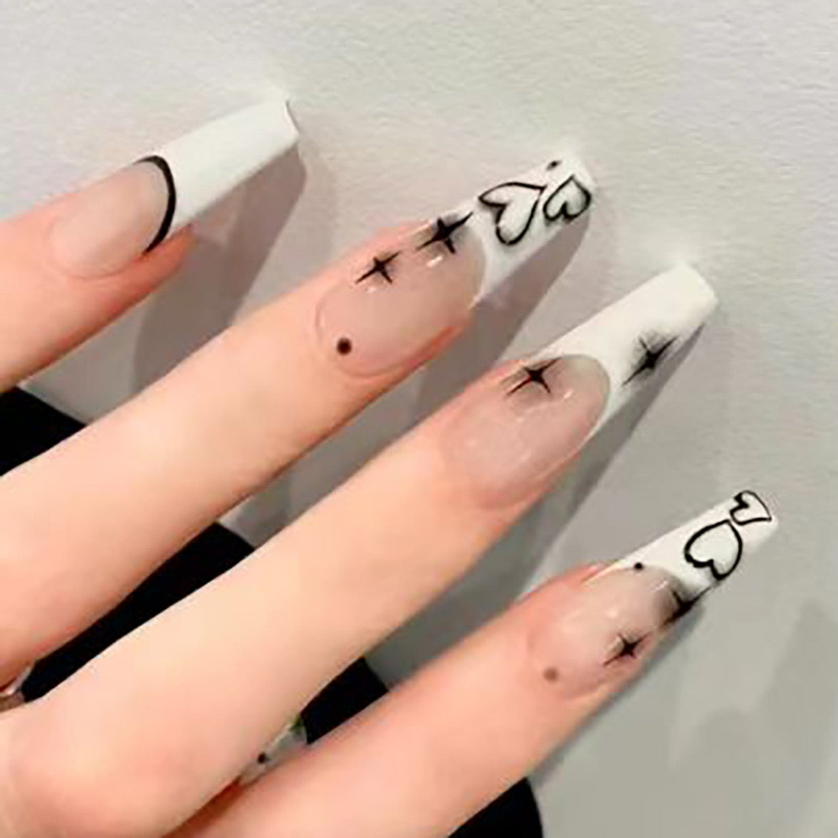 Chic Modern Long Coffin White Press-On Nails with Black Artistic Accents and Transparent Base