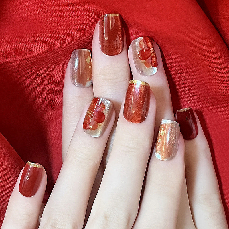 Radiant Ruby Short Square Dual-Tone Press-On Nails with Gold Flakes and Red Blossom Detailing