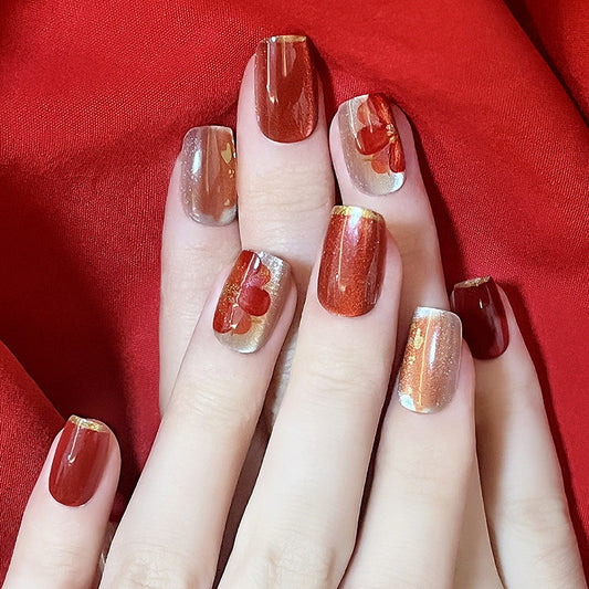Radiant Ruby Short Square Dual-Tone Press-On Nails with Gold Flakes and Red Blossom Detailing