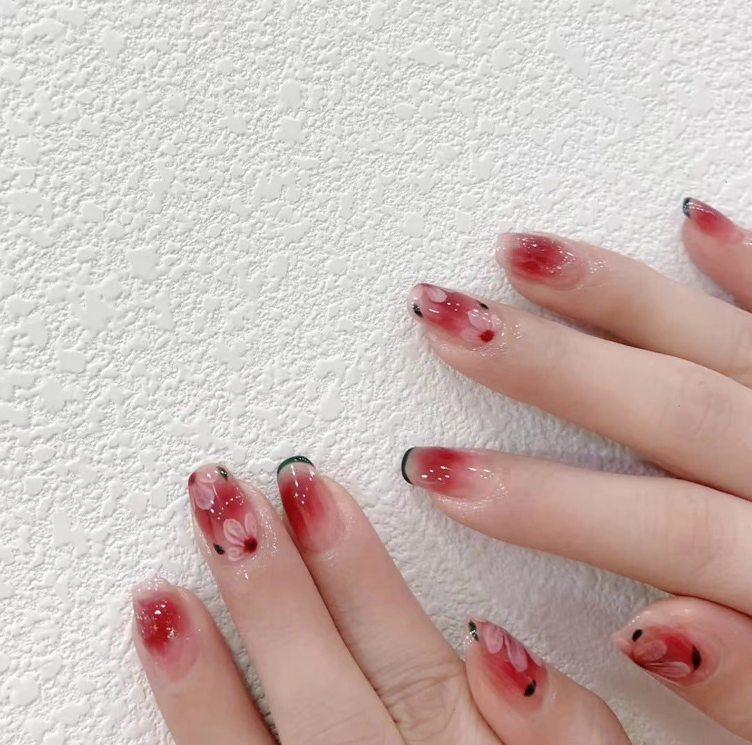 Enchanted Blossom Medium Coffin Gradient Red and Black Press On Nail Set with Delicate Floral Accents