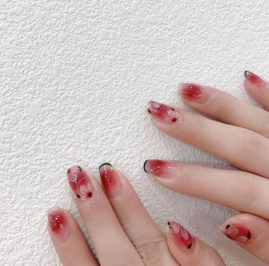 Enchanted Blossom Medium Coffin Gradient Red and Black Press On Nail Set with Delicate Floral Accents