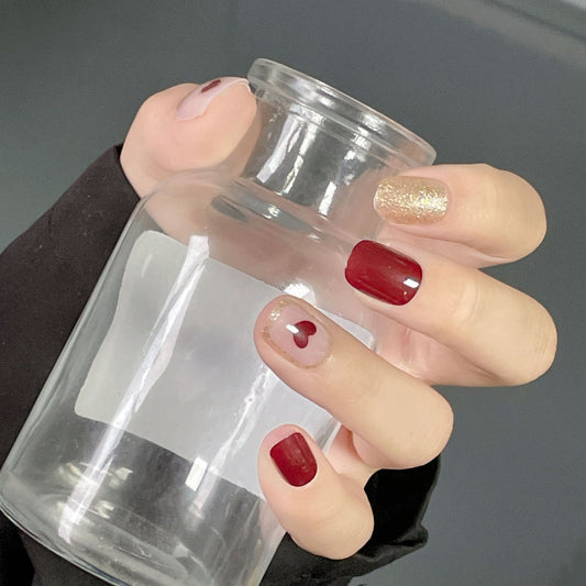 Glamorous Gala Medium Squoval Burgundy and Gold Glitter Accented Press On Nail Set with Heart Design