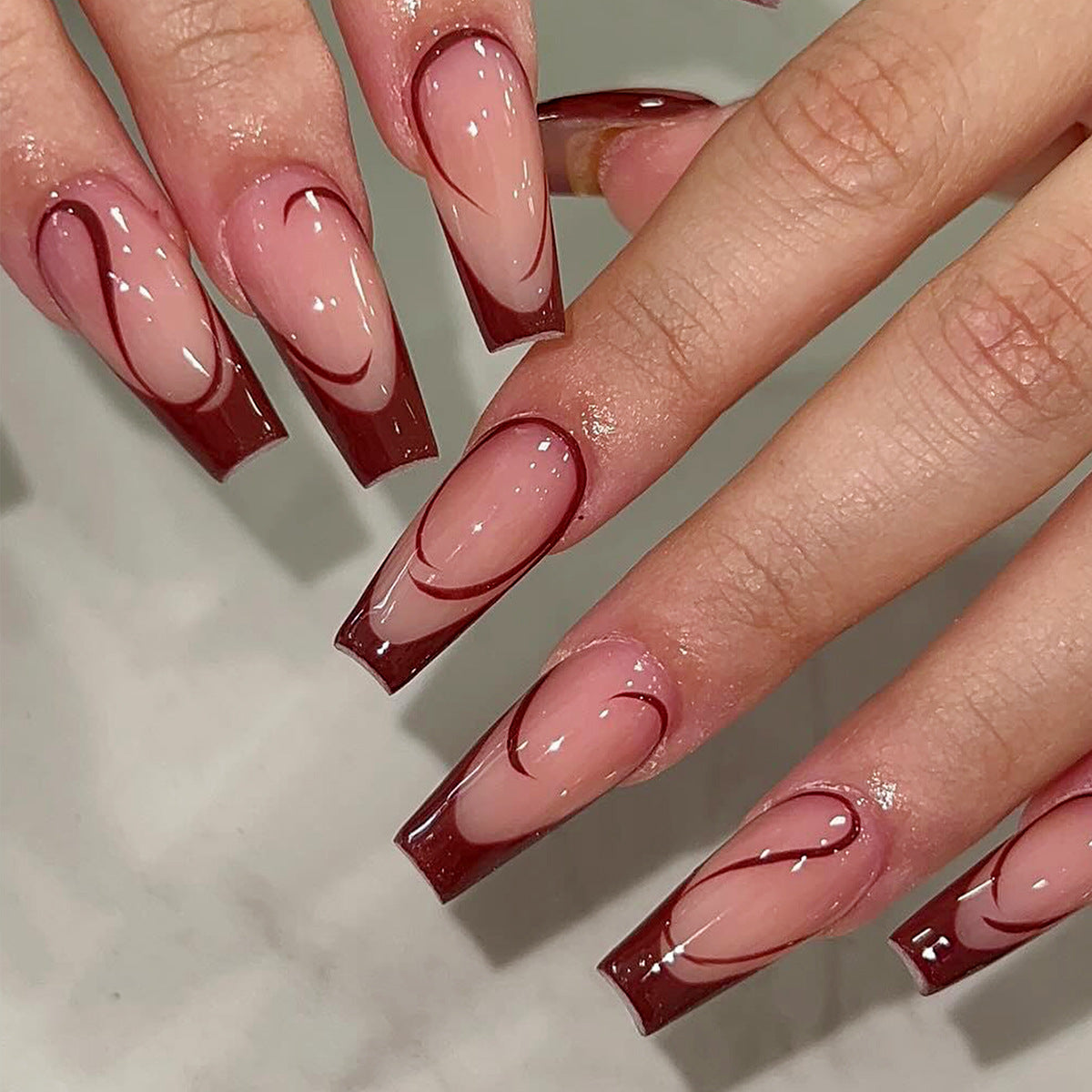 Enchanted Elegance Medium Coffin Burgundy Ombre Press On Nail Set with Intricate Swirl Design