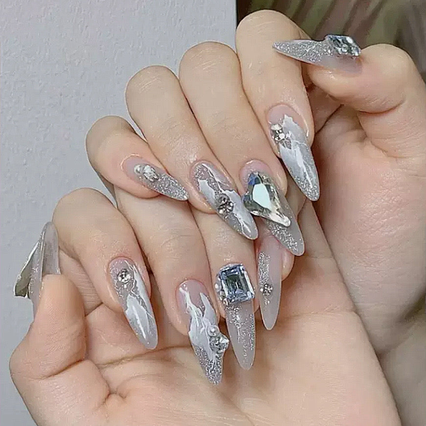 Icy Elegance Extra-Long Stiletto Clear Press-On Nail Set with Silver Glitter and Jewel Accents