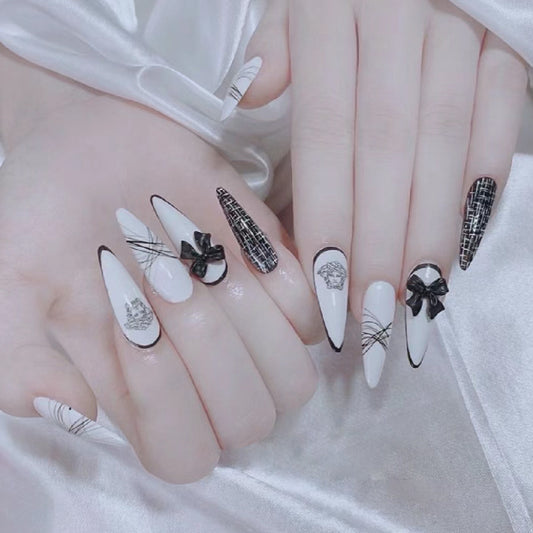 Elegant Noir Long Stiletto White Press-On Nail Set with Black Details and Bow Accents