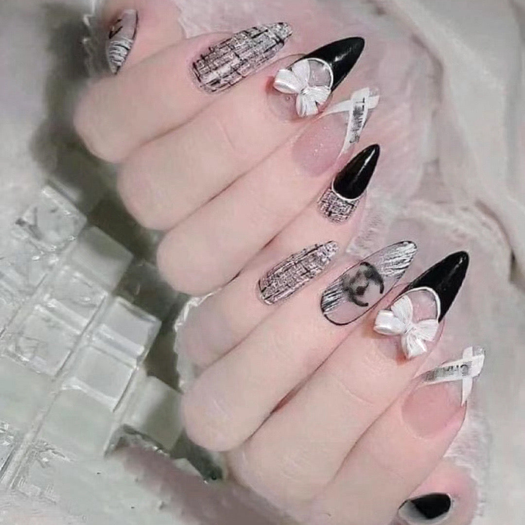 Gothic Elegance Extra Long Almond Black and White Press-On Nails with Newspaper Print and Bow Accents