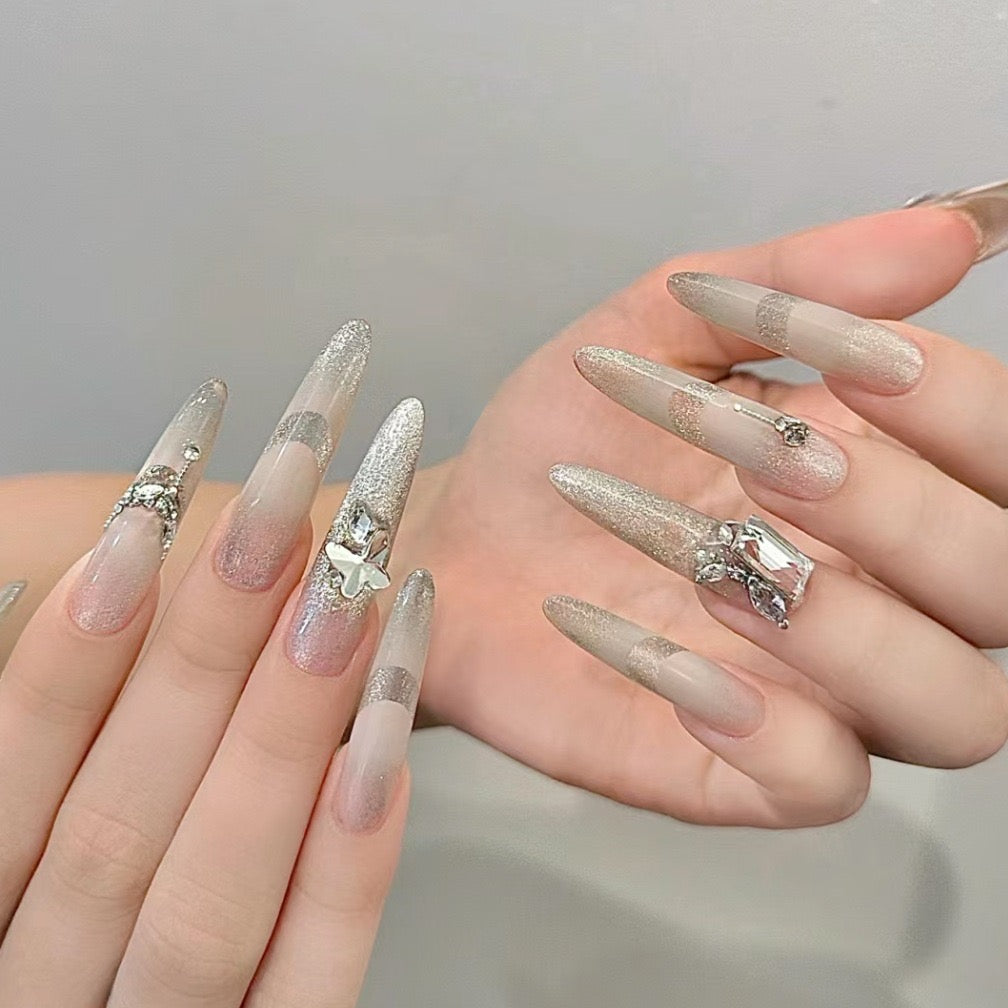Glittering Gala Long Stiletto Ombre Press-On Nail Set with Silver Glitter and Jewel Accents