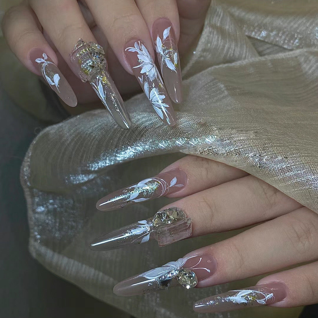 Ethereal Swan Long Stiletto Beige Press-On Nail Set with Silver Glitter Tips and White Feather Art