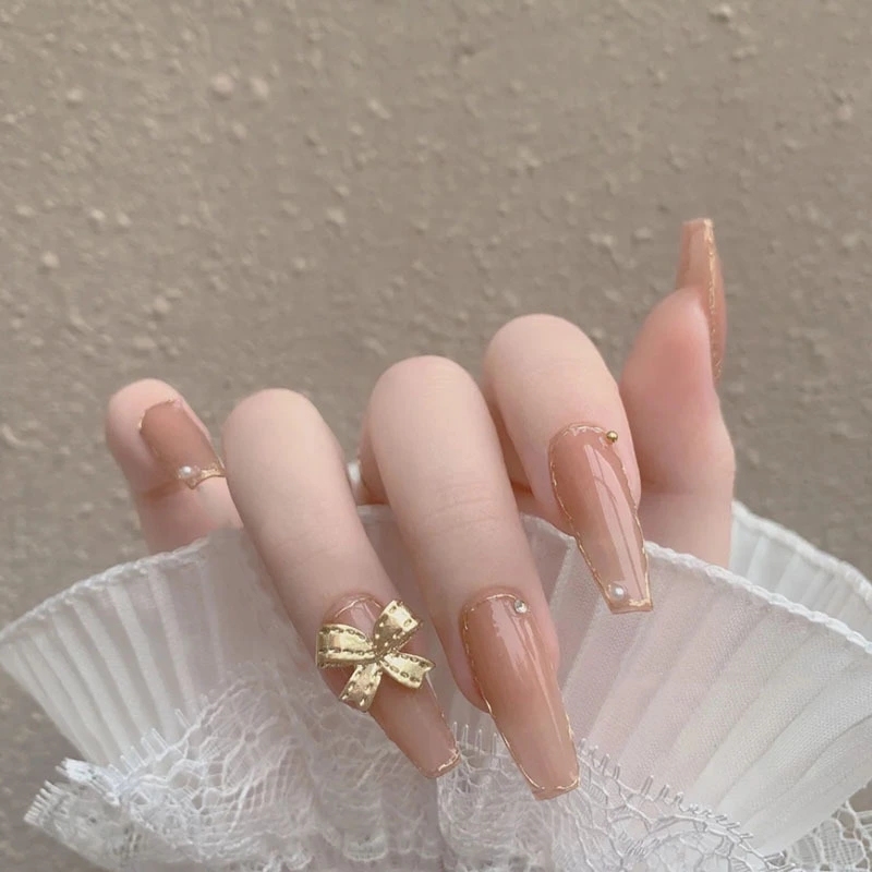Bridal Bliss Long Coffin Press on Nail Set in Beige with Glittering Gold Bow Detail