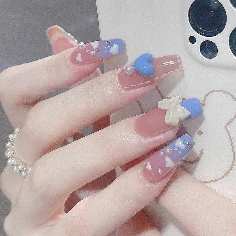 Whimsical Wonders Medium Coffin Press on Nail Set in Sheer Pink with Blue Tips, Cloud Patterns, and Pearl Embellishments