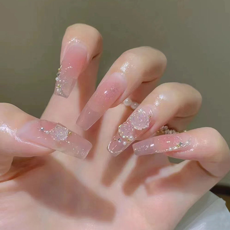 Ethereal Elegance Long Coffin Sheer Pink Nails with Glitter Overlay and Embellished Rose Detail